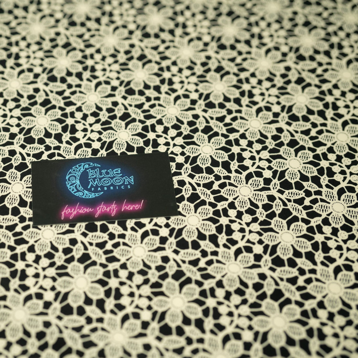 Ivory Flower Lace Pattern on Black Printed Spandex Fabric | Blue Moon Fabrics