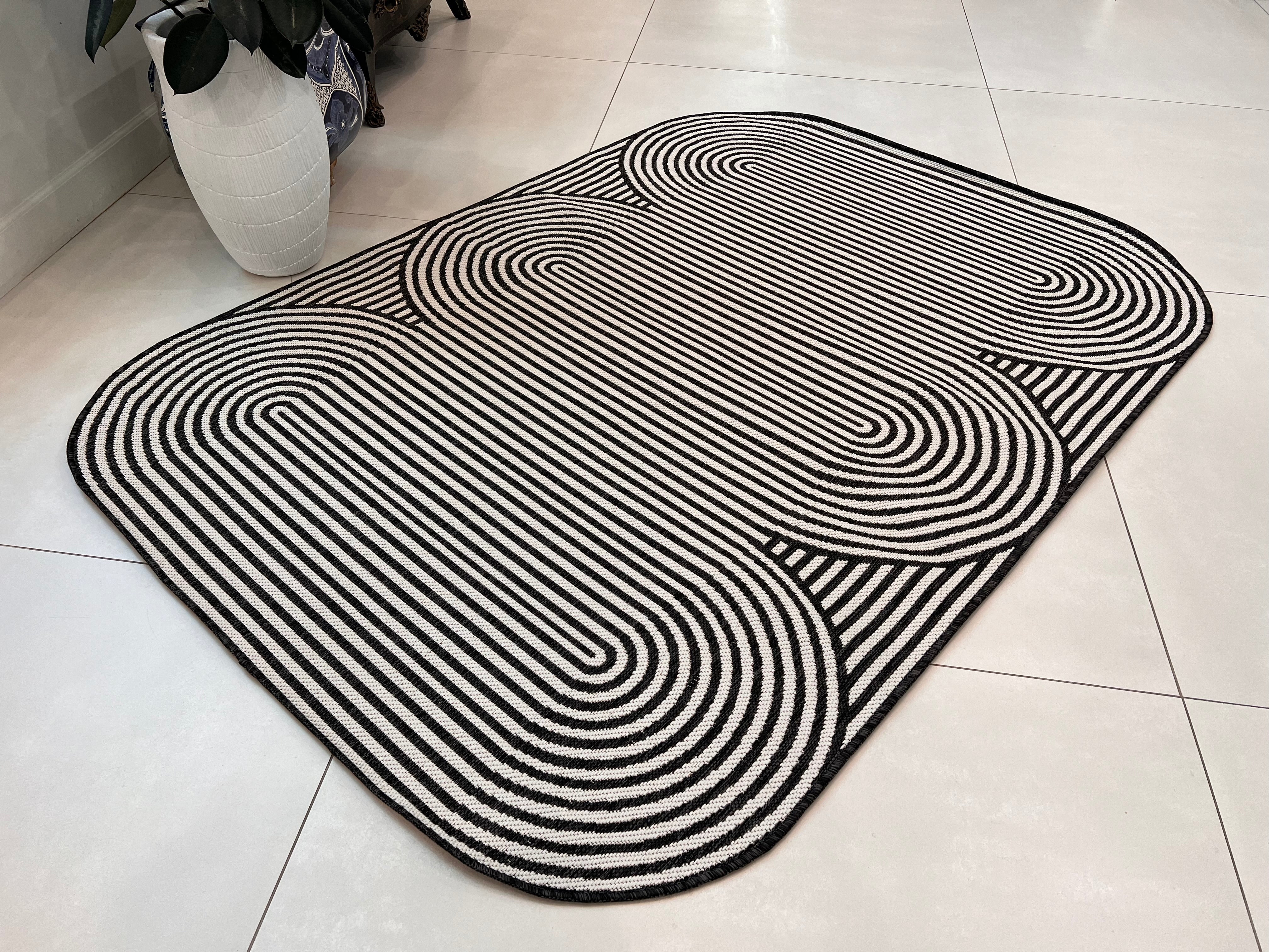 Black & Ivory Geometric Indoor/Outdoor Rug with Organic Live Edge.