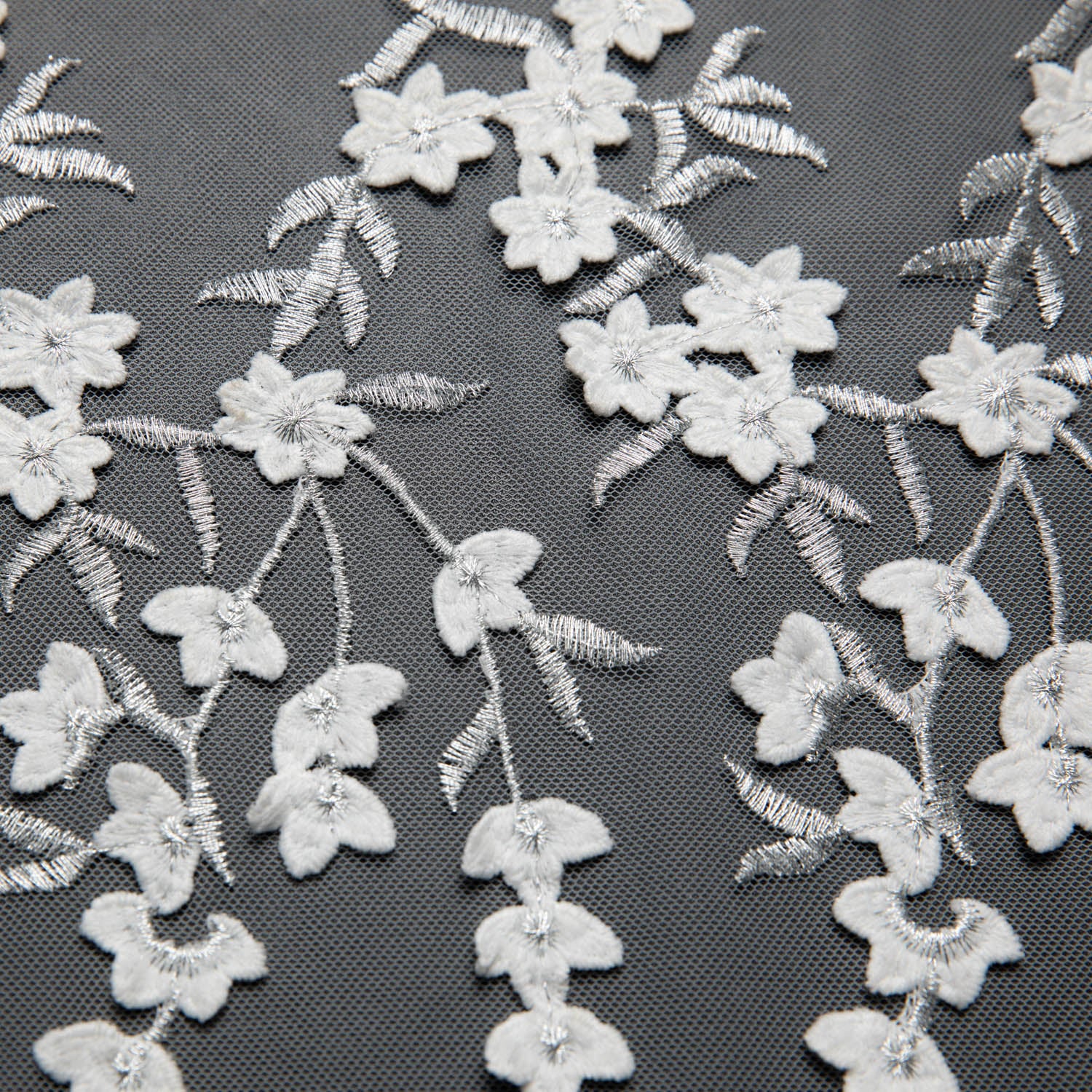 TULLE WITH EMB APPLIQUE 52/54" WHITE/SILVER FABRIC - Exquisite Fabrics