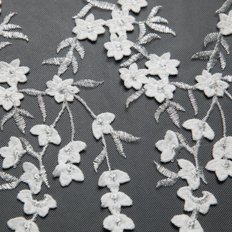 TULLE WITH EMB APPLIQUE 52/54" WHITE/SILVER FABRIC - Exquisite Fabrics