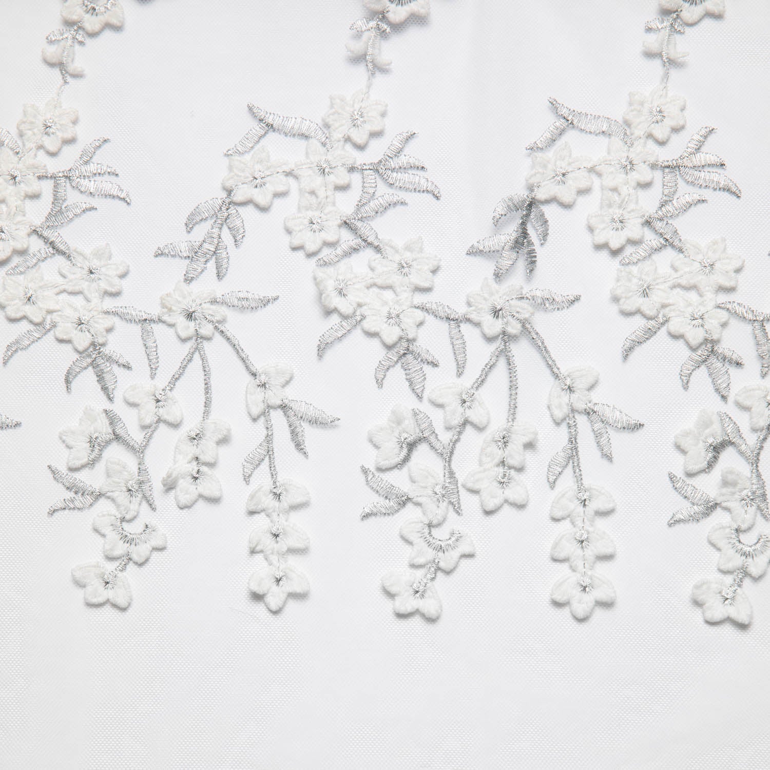 TULLE WITH EMB APPLIQUE 52/54" WHITE/SILVER FABRIC - Exquisite Fabrics