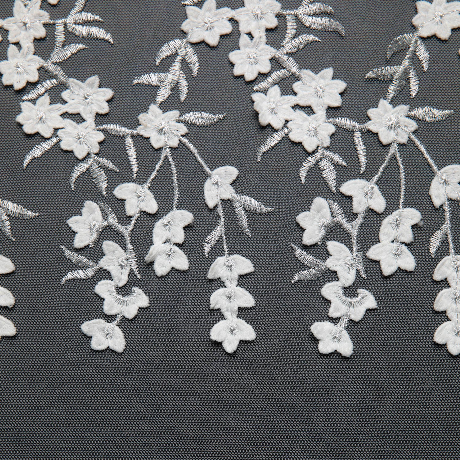 TULLE WITH EMB APPLIQUE 52/54" WHITE/SILVER FABRIC - Exquisite Fabrics