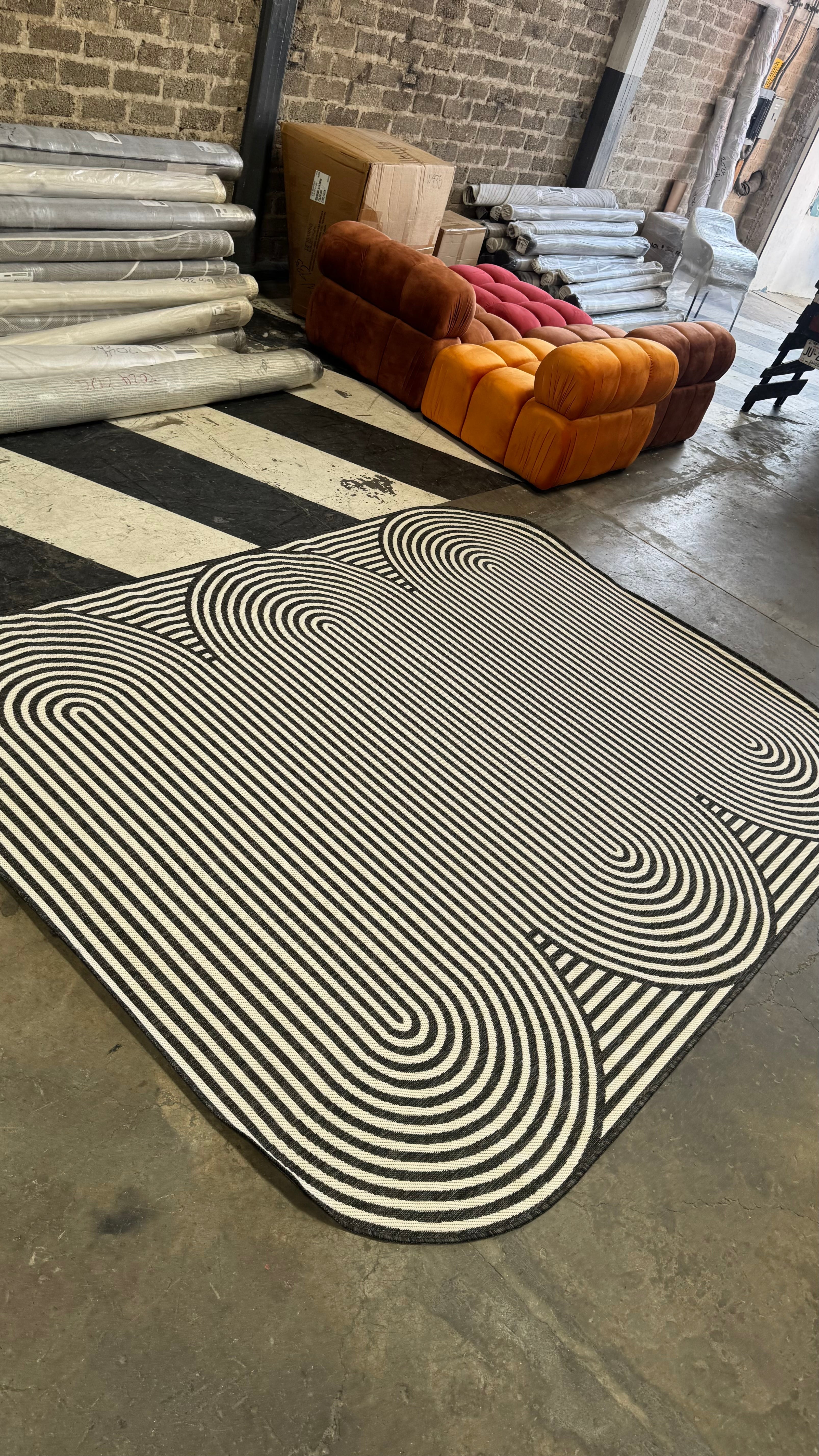 Black & Ivory Geometric Indoor/Outdoor Rug with Organic Live Edge.