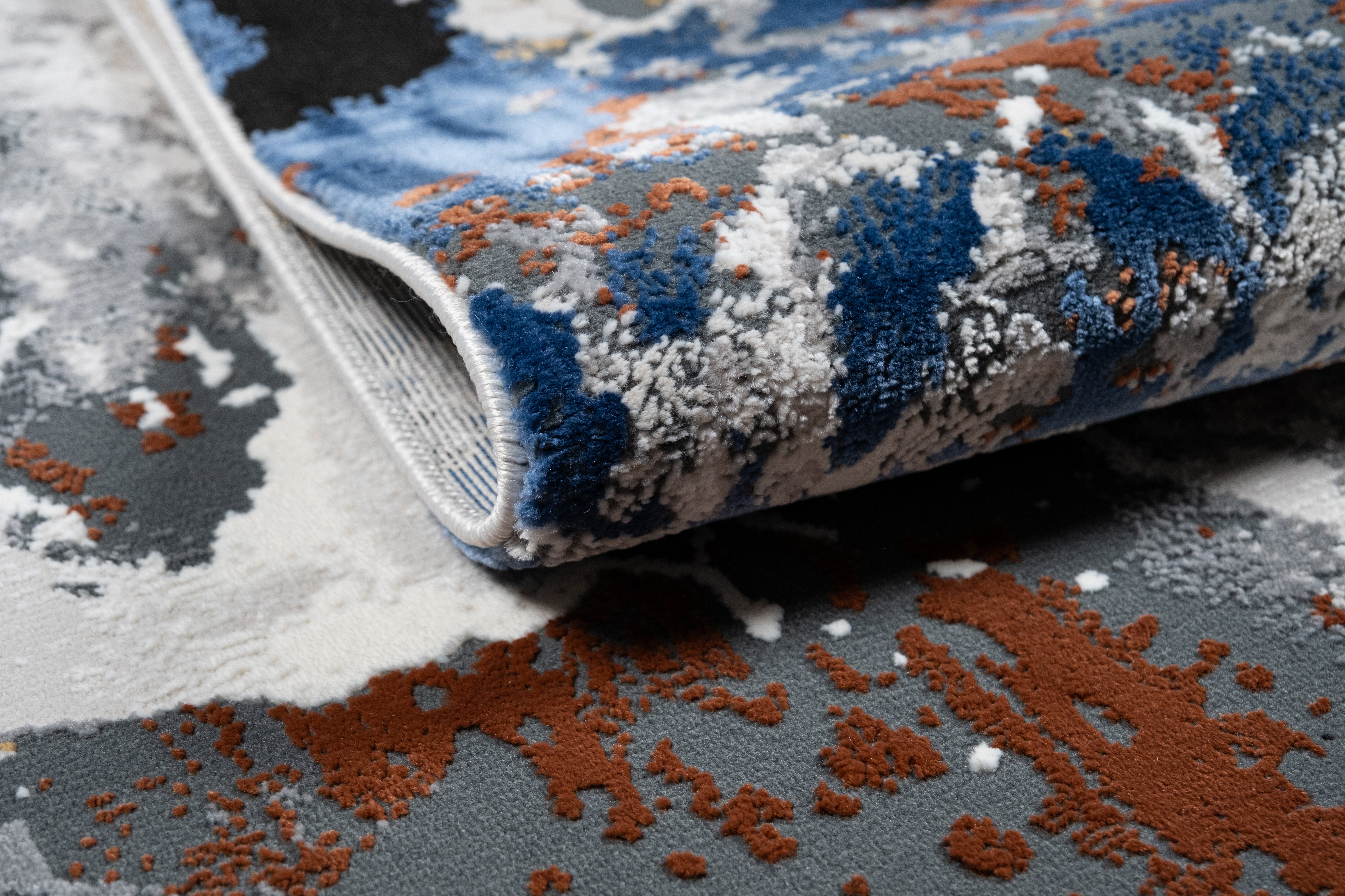Grey Marble Abstract Rug with Red-Brown, Tan, Cream & Ocean Blue Accents and hits of Black.