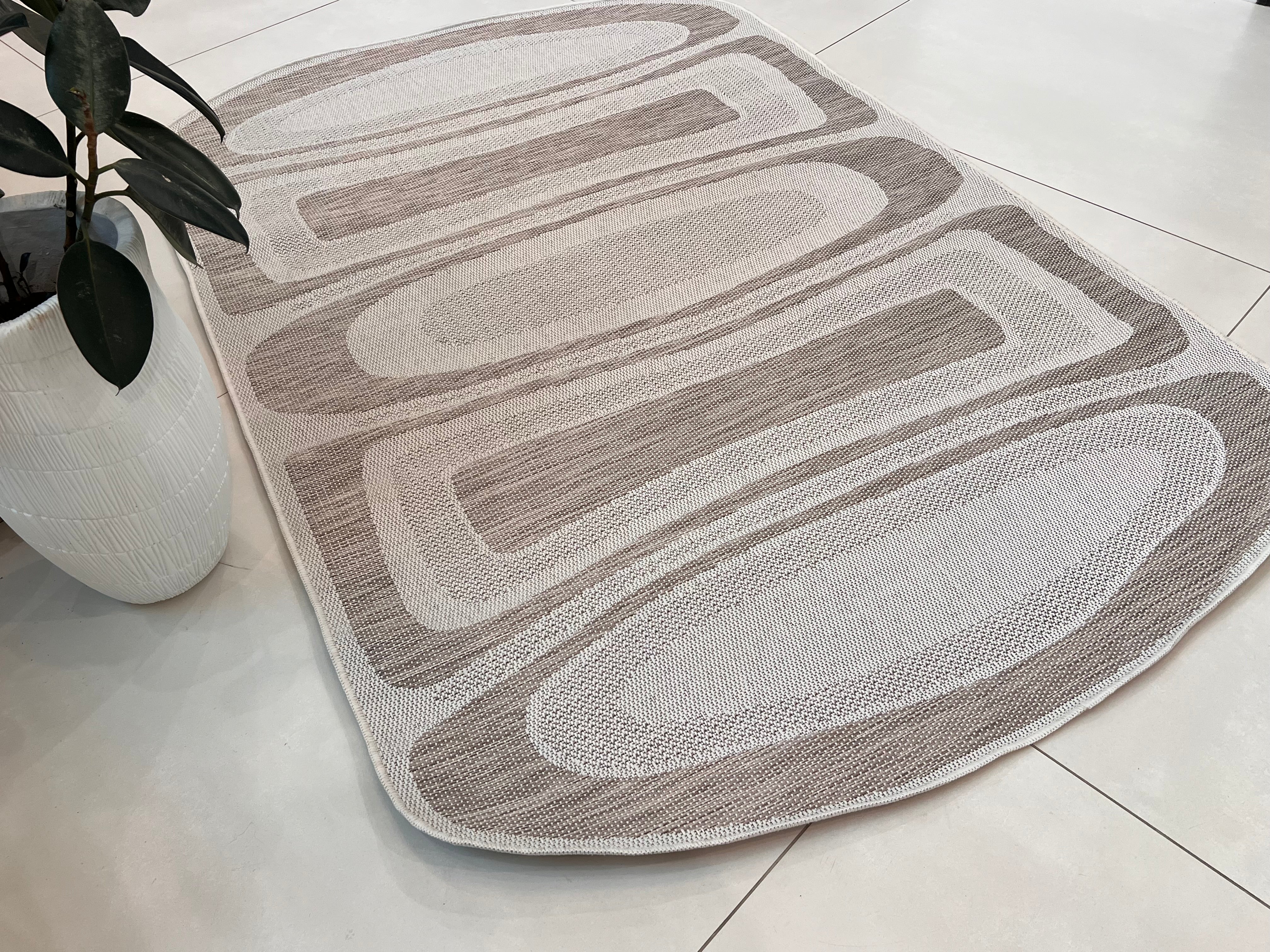 Two-Tone Sandy Beige Rug with Organic Live Edge Design.