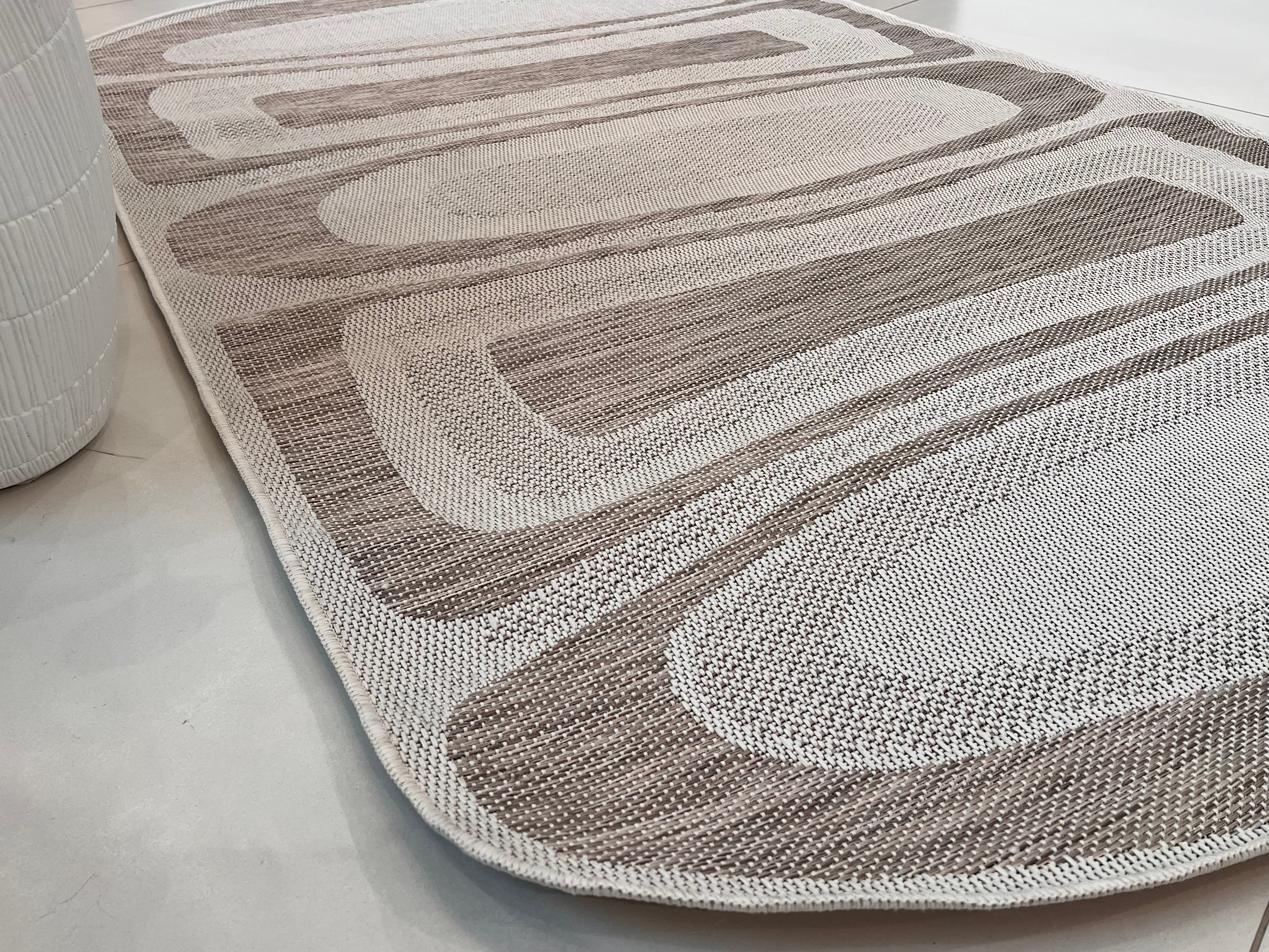 Two-Tone Sandy Beige Rug with Organic Live Edge Design.
