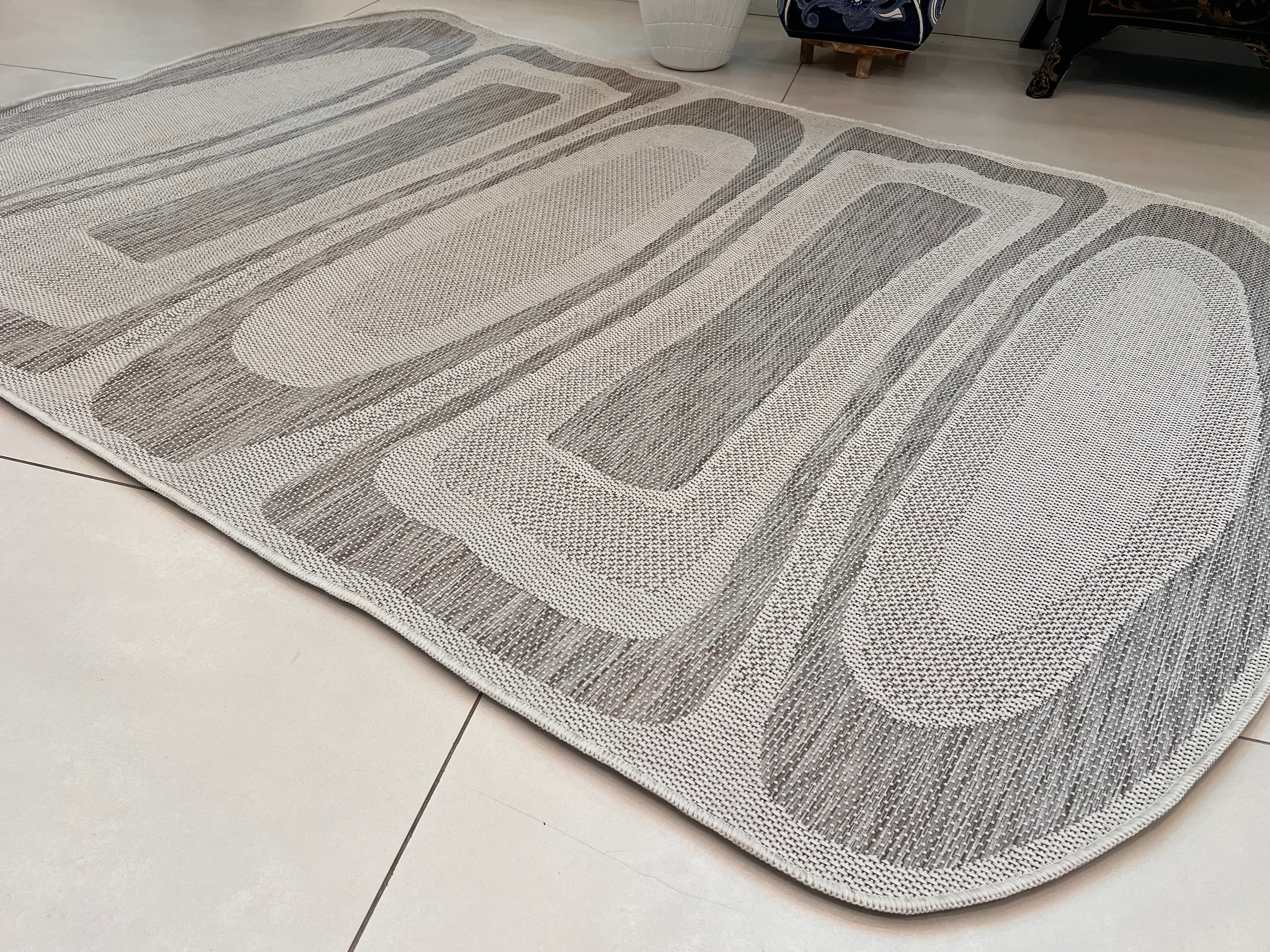 Two-Tone Sandy Beige Rug with Organic Live Edge Design.