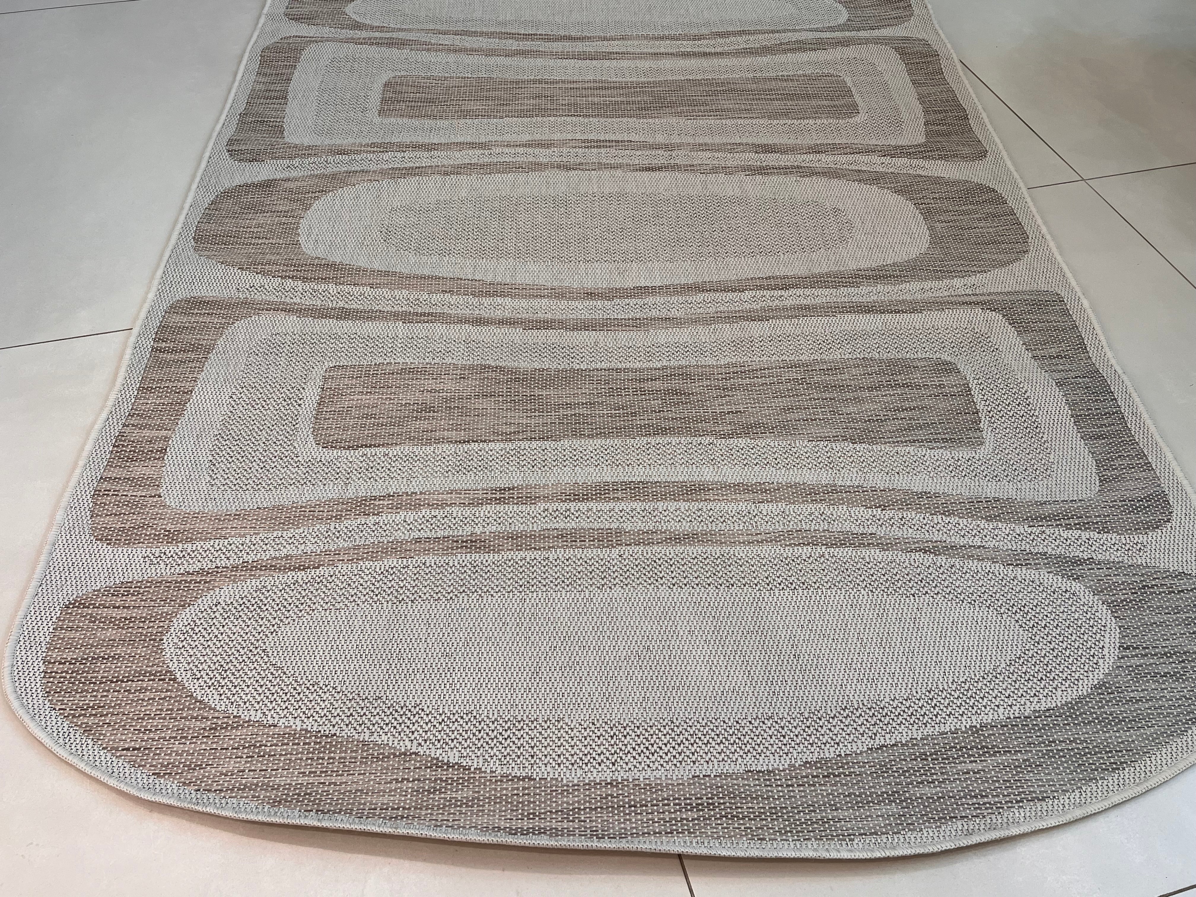 Two-Tone Sandy Beige Rug with Organic Live Edge Design.