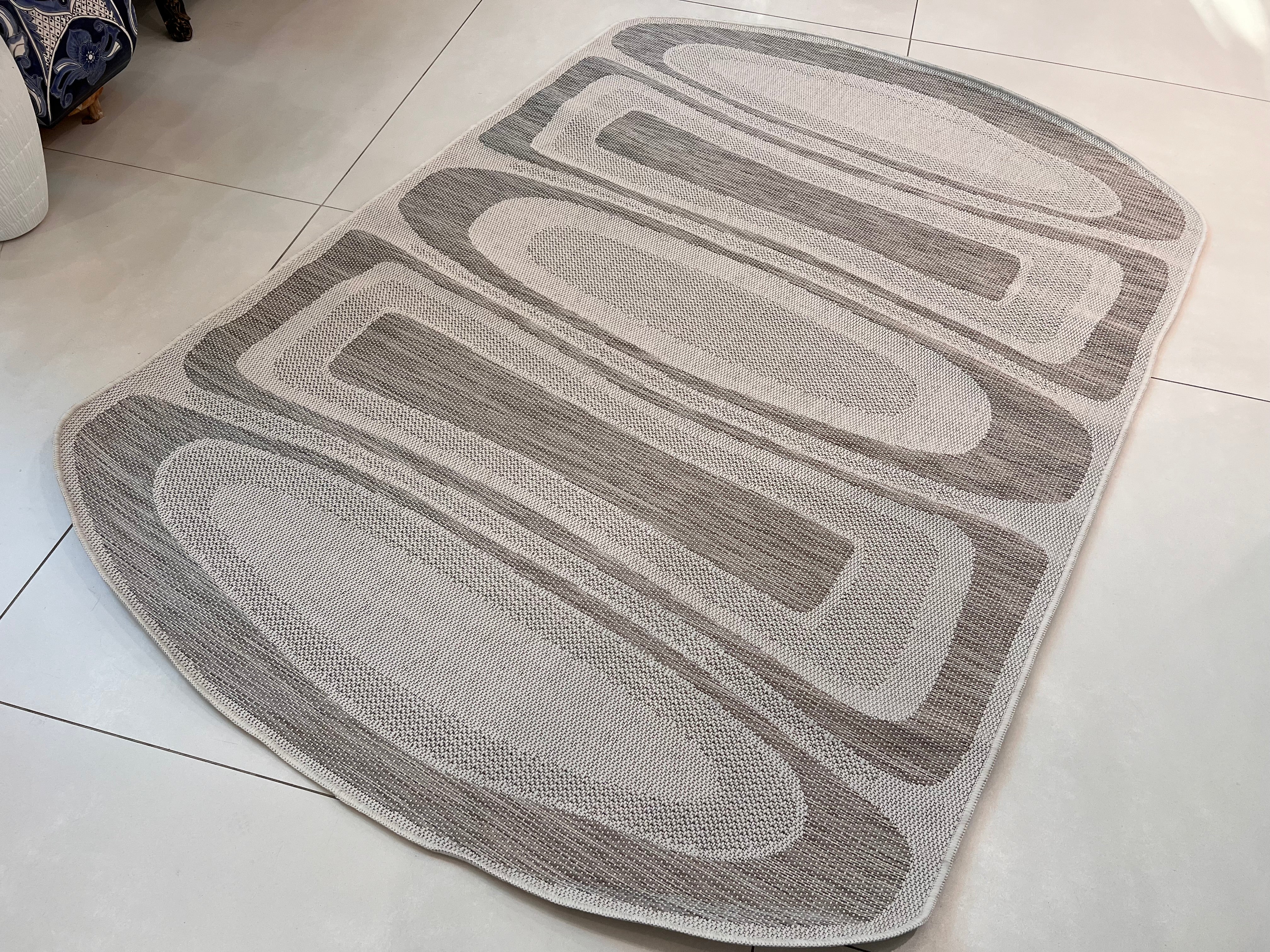 Two-Tone Sandy Beige Rug with Organic Live Edge Design.